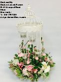 Birdcage with Flowers Around the Base 