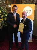Graham Brady MP Giving Neil Whittaker Honorary fellow of the Institute of Professional Florists