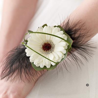 White Gerbera and Feather Wrist Corsage hand delivered in manchester , irlam , cadishead , swinton , salford , eccles ,worsley , urmston , straford , old trafford and through the Interflora Relay Service 