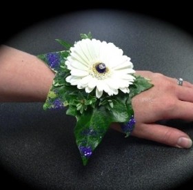 White Pearl Bracelet White Mini Gerbera, Diamanta Centre & Purple Glitter hand delivered in local areas like Irlam , Cadishead , manchester , Worsl;ey , Winton , salford , urmston , Peel Green , Eccles , Old trafford 