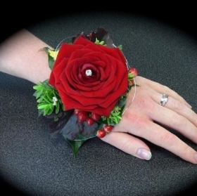 Cupid Heart Demote Bracelet, Red Rose & Hypericum which is hand delivered in Manchester , Salford , Eccles , Monton , Irlam , Cadishead , Urmston , Flixton , Firs wood , Stretford , old Trafford 