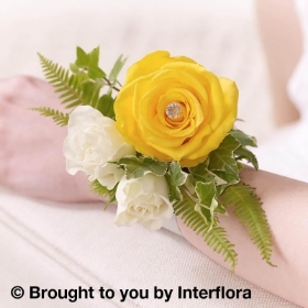 Yellow Rose and Fern Wrist Corsage hand delivered in manchester , irlam , cadishead , monton , eccles , worsley , urmston , flixton , friswood, old trafford , swinton , salford manchester and through Interflora Relay service 